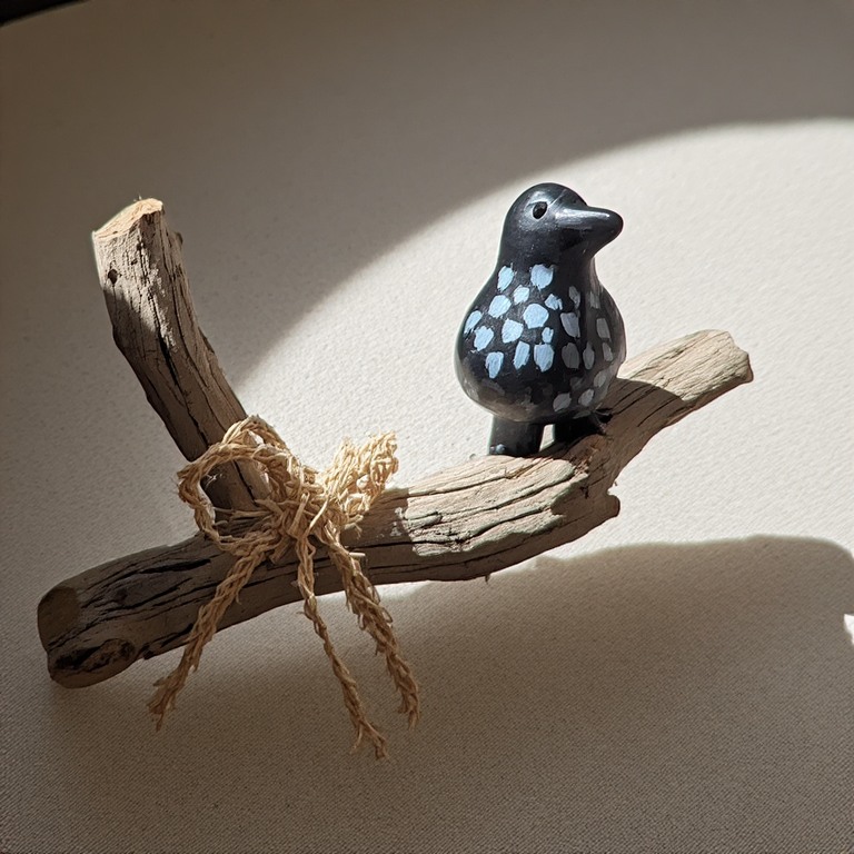 Painted Crow on Driftwood Perch